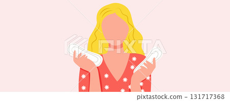 Girl holding sanitary pads on pink background. Women period and menstruation concept 131717368