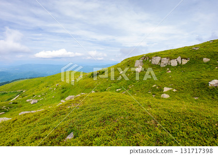 breathtaking mountain landscape with massive rocks on alpine meadow in summer. beautiful nature of carpathian alps. dramatic scenery with hills and green slopes under overcast sky. outdoor adventure breathtaking mountain landscape with massive rocks on alpine meadow in summer. beautiful nature of carpathian alps. dramatic scenery with hills and green slopes under overcast sky. outdoor adventure 131717398
