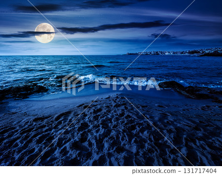 sunrise on a sandy town beach in mellow season at night. beautiful and warm weather on the shores of black sea. coast in full moon light 131717404