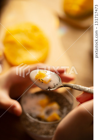 Chia pudding with coconut milk and mango pieces close up Chia pudding with coconut milk and mango pieces close up 131717473