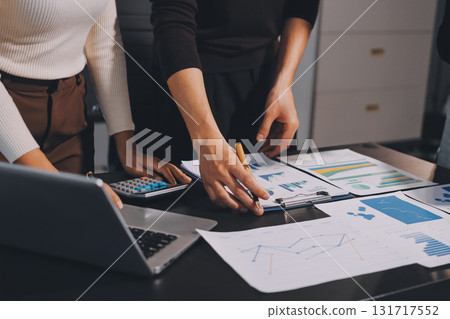 Accounting company provide finance and taxation planning for profitable cash flow, Auditor and accountant team working in office, analyze financial data and accounting record with calculator.Insight Accounting company provide finance and taxation planning for profitable cash flow, Auditor and accountant team working in office, analyze financial data and accounting record with calculator.Insight 131717552