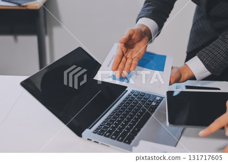 Accounting company provide finance and taxation planning for profitable cash flow, Auditor and accountant team working in office, analyze financial data and accounting record with calculator.Insight 131717605