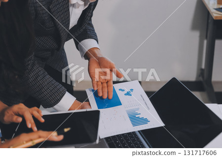 Accounting company provide finance and taxation planning for profitable cash flow, Auditor and accountant team working in office, analyze financial data and accounting record with calculator.Insight 131717606