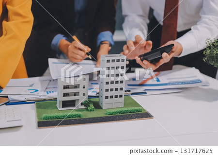 Real estate agent and customer signing contract to buy house, insurance or loan real estate.rent a house,get insurance or loan real estate or property. Real estate agent and customer signing contract to buy house, insurance or loan real estate.rent a house,get insurance or loan real estate or property. 131717625