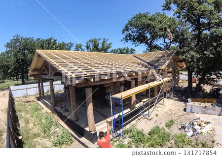 Stage of construction of a wooden house. Stage of construction of a wooden house. 131717854