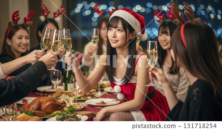 Woman dressed as Santa at Christmas party 131718254