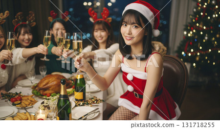 Woman dressed as Santa at Christmas party 131718255