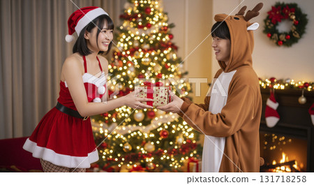 Woman dressed as Santa at Christmas party Woman dressed as Santa at Christmas party 131718258