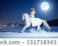 A white horse and a woman in a white dress running on a snowy moonlit night_01 131718343
