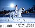 A white horse and a woman in a white dress running on a snowy moonlit night_02 131718344