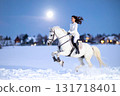 A woman in a white dress galloping on a white horse on a snowy moonlit night 131718401