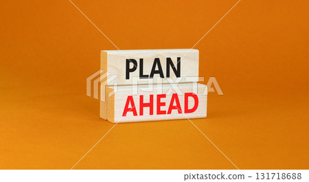 Plan ahead symbol. Concept word Plan ahead on beautiful wooden blocks. Beautiful orange paper background. Business plan ahead concept. Copy space. 131718688