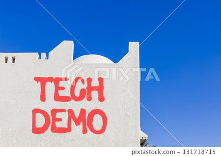 Tech demo symbol. Concept word Tech demo on beautiful white wall. Beautiful blue sky background. Business tech demo concept. Copy space. 131718715
