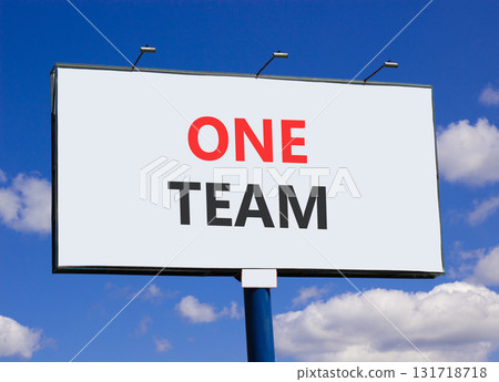 One team symbol. Concept word One team on beautiful white billboard. Beautiful blue sky and clouds background. Business one team concept. Copy space. One team symbol. Concept word One team on beautiful white billboard. Beautiful blue sky and clouds background. Business one team concept. Copy space. 131718718