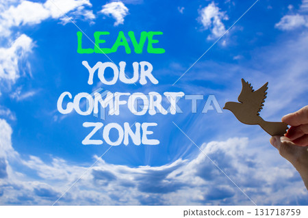 Leave your comfort zone symbol. Concept words Leave your comfort zone on beautiful blue sky. Beautiful blue sky clouds background. Business psychological Leave your comfort zone concept. Copy space. 131718759