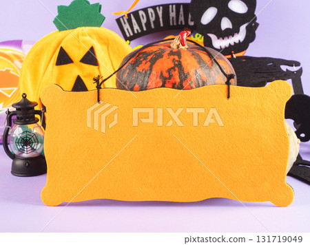 Halloween party ornament with pumpkins and spooky decor on purple 131719049