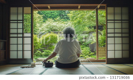 A woman looking at a shoji screen 131719086