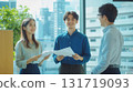 Young employees talking with smiles 131719093