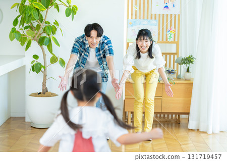 Families playing in the living room Families playing in the living room 131719457