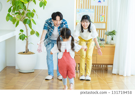 Families playing in the living room Families playing in the living room 131719458
