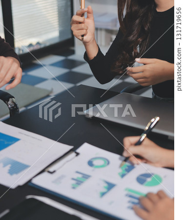 Accounting company provide finance and taxation planning for profitable cash flow, Auditor and accountant team working in office, analyze financial data and accounting record with calculator.Insight 131719656