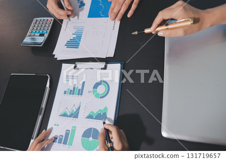 Accounting company provide finance and taxation planning for profitable cash flow, Auditor and accountant team working in office, analyze financial data and accounting record with calculator.Insight 131719657