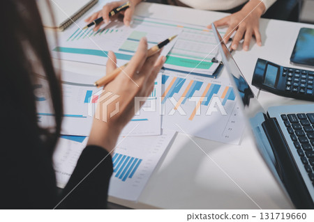 Accounting company provide finance and taxation planning for profitable cash flow, Auditor and accountant team working in office, analyze financial data and accounting record with calculator.Insight 131719660