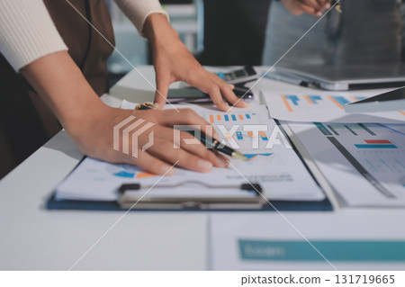 Accounting company provide finance and taxation planning for profitable cash flow, Auditor and accountant team working in office, analyze financial data and accounting record with calculator.Insight Accounting company provide finance and taxation planning for profitable cash flow, Auditor and accountant team working in office, analyze financial data and accounting record with calculator.Insight 131719665