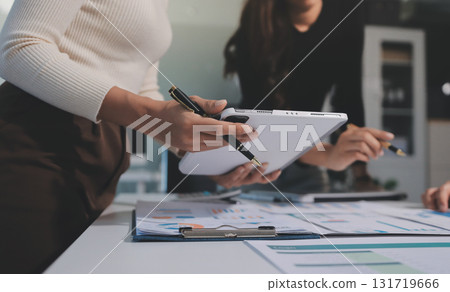 Accounting company provide finance and taxation planning for profitable cash flow, Auditor and accountant team working in office, analyze financial data and accounting record with calculator.Insight Accounting company provide finance and taxation planning for profitable cash flow, Auditor and accountant team working in office, analyze financial data and accounting record with calculator.Insight 131719666