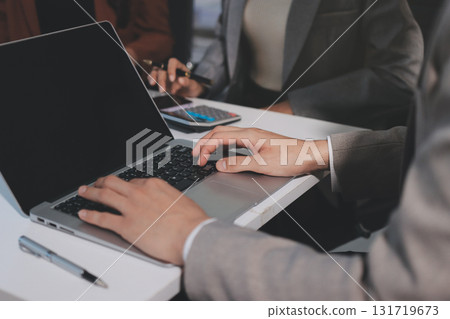 Accounting company provide finance and taxation planning for profitable cash flow, Auditor and accountant team working in office, analyze financial data and accounting record with calculator.Insight Accounting company provide finance and taxation planning for profitable cash flow, Auditor and accountant team working in office, analyze financial data and accounting record with calculator.Insight 131719673