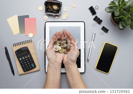 Money saving concept with euro coins in woman's hands 131720562