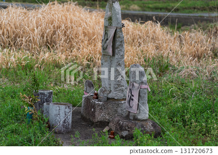A cute Jizo statue that is loved by the common people and watches over the area. 131720673