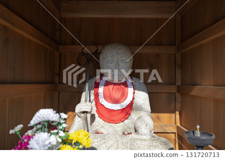 A cute Jizo statue that is loved by the common people and watches over the area. 131720713