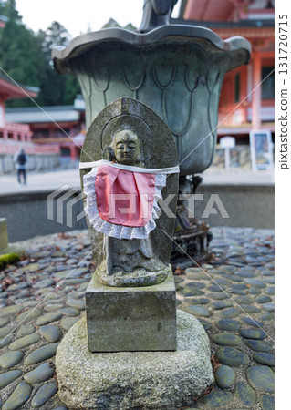 A cute Jizo statue that is loved by the common people and watches over the area. 131720715