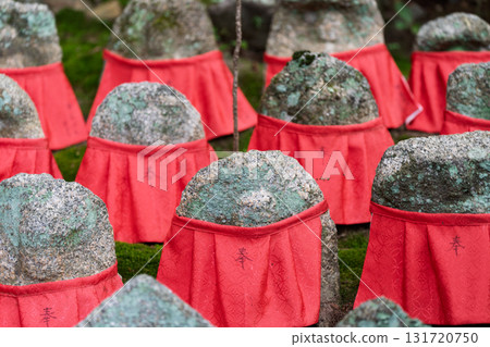 A cute Jizo statue that is loved by the common people and watches over the area. 131720750