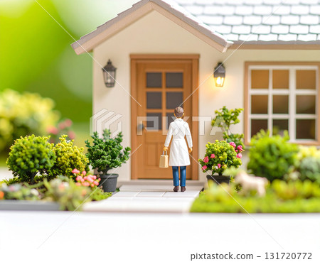 Image of a home medical visit | A miniature photo of a house with a garden and a doctor visiting the home Image of a home medical visit | A miniature photo of a house with a garden and a doctor visiting the home 131720772
