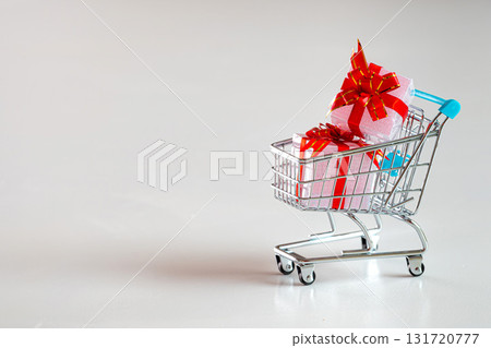 shopping cart full with gifts isolated on white background 131720777