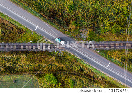 aerial top down view on railroad crossing with asphalt road aerial top down view on railroad crossing with asphalt road 131720784