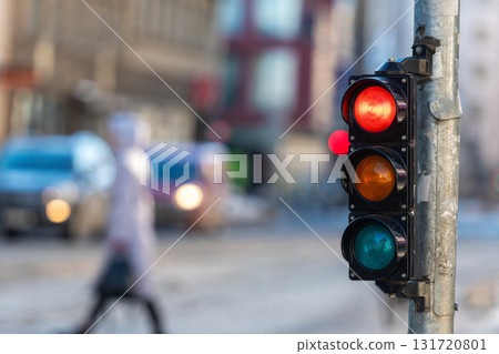 closeup of small traffic semaphore with red light against the backdrop of the city traffic closeup of small traffic semaphore with red light against the backdrop of the city traffic 131720801
