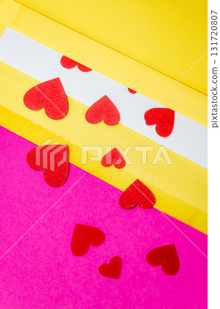 red little hearts coming out from envelope isolated on pink background with copy space, loveletter concept 131720807