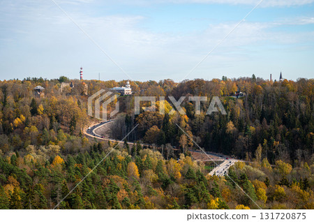 view from Krimulda manor to the valley of the Gauja National Park, the river Gauja, bridge and road view from Krimulda manor to the valley of the Gauja National Park, the river Gauja, bridge and road 131720875