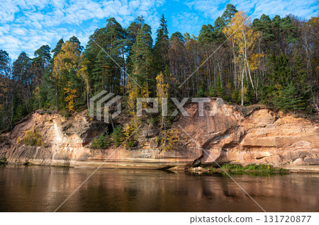 Devils rock and cave by the shores of the River Gauja, Sigulda, Latvia Devils rock and cave by the shores of the River Gauja, Sigulda, Latvia 131720877