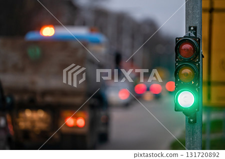 traffic light on the street junction with beautiful bokeh, city with cars in the background traffic light on the street junction with beautiful bokeh, city with cars in the background 131720892