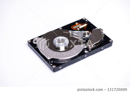 Close up inside of computer hard disk drive HDD isolated on white background Close up inside of computer hard disk drive HDD isolated on white background 131720899
