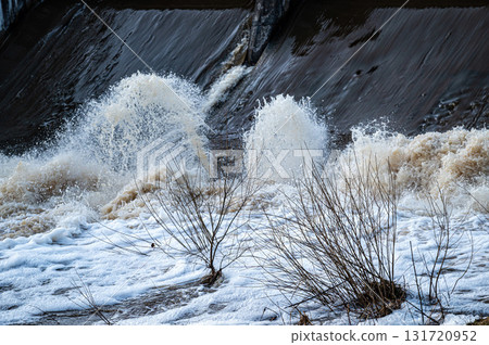 close up of flowing water, rapid water splashes of an white water river or stream, bubbly water close up of flowing water, rapid water splashes of an white water river or stream, bubbly water 131720952