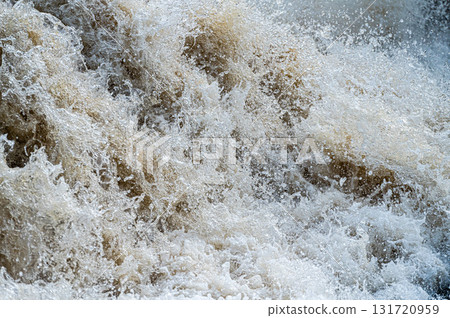 close up of flowing water, rapid water splashes of an white water river or stream, bubbly water close up of flowing water, rapid water splashes of an white water river or stream, bubbly water 131720959
