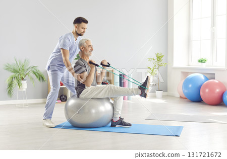 Doctor Or Nurse Providing Rehabilitation Session With Stretching For Patient Doctor Or Nurse Providing Rehabilitation Session With Stretching For Patient 131721672