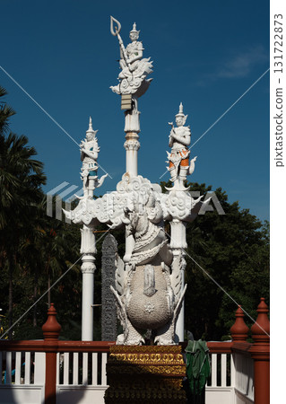 Giant statue and cement pole at Tha Mai temple, Thailand 131722873