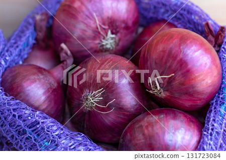 Red Onion Lying On Wooden Background, Harvest Season, spice. Red Onion Lying On Wooden Background, Harvest Season, spice. 131723084