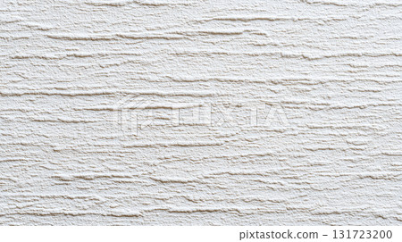Textured white wall with a subtle pattern creates a modern and clean aesthetic in an interior space 131723200